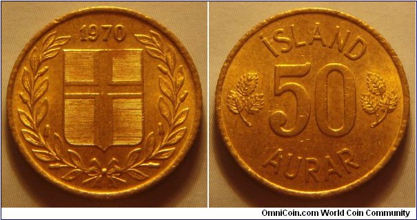 Iceland | 
50 Aurar, 1970 | 
19 mm, 2.4 gr. | 
Nickel-brass | 

Obverse: Flag of Iceland in shield within laurel wreath, date above |
Lettering: 1970 | 

Reverse: Denomination | 
Lettering: ÍSLAND 50 AURAR |