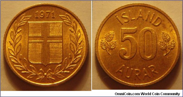 Iceland | 
50 Aurar, 1971 | 
19 mm, 2.4 gr. | 
Nickel-brass | 

Obverse: Flag of Iceland in shield within laurel wreath, date above |
Lettering: 1971 | 

Reverse: Denomination | 
Lettering: ÍSLAND 50 AURAR |