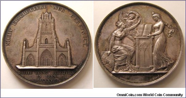 1828 Swiss/French 300th Anniversary of the Reformation in City of Bern Medal by Jean-François-Antoine Bovy. Silver: 55MM
Obv: West façade of the Cathedral, legend NICHT ERSCHUTTERT NUR CEREINICT. Exergue DRITTE EVANG; IUBELFEIER IN BERN MDCCCXXVIII. Signed A.BOVY F. Rev: City goddess seated on a Bible held by religion, its floats a Zwingli genius with banner, signed A. BOVY F.
