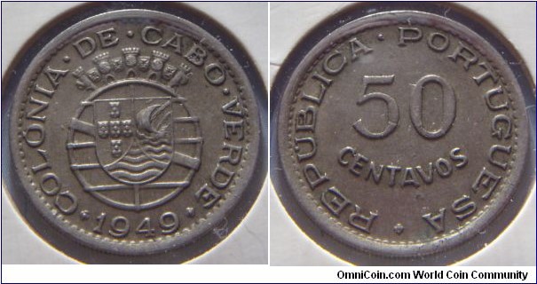 Cape Verde | 
50 Centavos, 1949 | 
22.9 mm, 4.6 gr. | 
Nickel-bronze | 

Obverse: Portuguese Coat of Arms, date below | 
Lettering: COLÓNIA • DE • CABO • VERDE 1949 | 

Reverse: Denomination | 
Lettering: REPÚBLICA • PORTUGUESA 50 CENTAVOS |