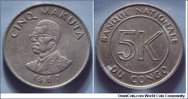 Democratic Republic of the Congo | 
5 Makuta, 1967 | 
25.1 mm, 6.41 gr. | 
Copper-nickel | 

Obverse: President Mobutu Sese Seko facing left, denomination above, date below | 
Lettering: CINQ MAKUTA 1967 | 

Reverse:  Denomination | 
Lettering: BANQUE NATIONALE DU CONGO 5K |