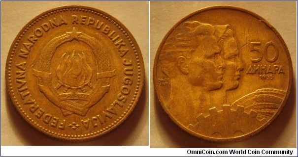 Yugoslavia | 
50 Federation Dinars, 1955 | 
25.5 mm, 6 gr. | 
Aluminium-bronze | 

Obverse: National Coat of Arms | 
Lettering: FEDERATIVNA NARODNA REPUBLIKA JUGOSLAVIJA | 

Reverse: Male and female head facing right, Ear of wheat and Cogwheel, denomination right, date below | 
Lettering: 50 ДИНАРА 1955 |