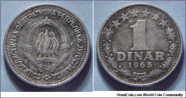 Yugoslavia | 
1 Hard Dinar, 1965 | 
21.8 mm, 3.9 gr. | 
Copper-nickel | 

Obverse: National Coat of Arms | 
Lettering: СОЦИJАЛИСТИЧКА ФЕДЕРАТИВНА РЕПУБЛИКА JУГОСЛАВИJА | 

Reverse: Denomination within wreath, date below | 
Lettering: 1 DINAR 1965 |