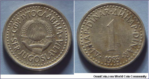 Yugoslavia | 
1 Hard Dinar, 1983 | 
20 mm, 3.6 gr. | 
Copper-brass | 

Obverse: National Coat of Arms | 
Lettering: •СФР JУГОСЛАВИJА•SFR JUGOSLAVIJA | 

Reverse: Denomination, date below | 
Lettering: •ДИНАР•DINAR•ДИНАР•DINAR• 1 1983 |
