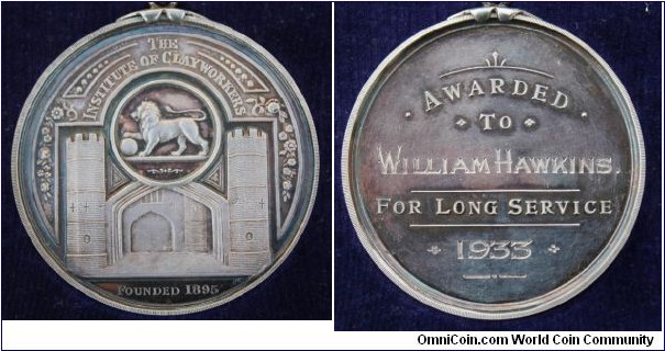 1895-1933 UK England Institute of Clayworkers Long Service Medal. Silver: 58MM./77.5 gms.
Obv: Lion with Ball in center circle. Castle underneath. Legend THE INSTITUTE OF CLAYWORKERS. FOUNDED 1895. Rev: Awarded To William Hawkins For Long Service.1933.
