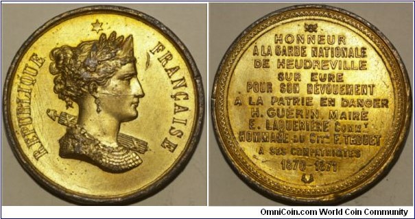 1870-1871 France National Guard HEUDREVILLE SUR EURE Guérin Laquérière War Medal. Gilted Bronze. 50MM./75.9 gms.
Obv: Head of  Cérès right with Oilver wreath and surrounded by Oak. Legend REPUBLIQUE FRANCAISE. A David Star above. Obv: Legend in 11 lines.
