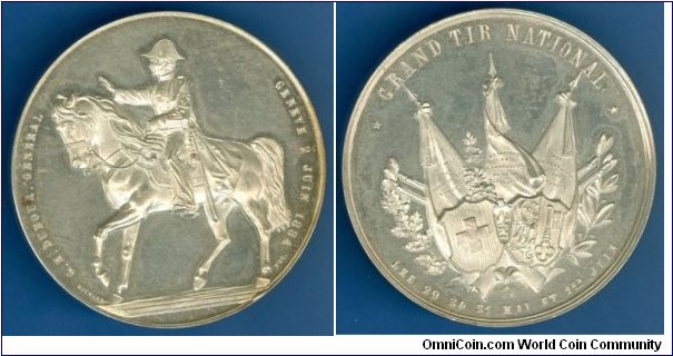 1884 Swiss Eidg. Schützenfest Geneve General Dufour Medal. Silver: 47MM./56.65 gms. 322 Stück.
Obv: General Dufour on horse. Rev: Banners & three shields.
