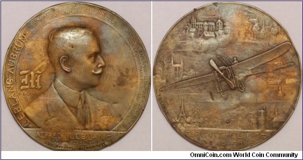 1910 France Aviation Circuit de l'Est 1910 Alfred LeBlanc Medal by V S Canale. Gilt Bronze: 100MM./200 gms.
Obv: Bust of Alfred Leblanc to right.  Legend: name of all competitors in Circuit l'Est surround on the outer circle. Signed  V.S. CANALE. Exergue ALFRED LEBLANC/GAGNANT CIRCUIT/SUR APPAREIL BLERIOT N° 22. Rev:  Champion French plane Blériot. N° 22 flying above the cloud surround by bird-eye view of 6 Cities alone the route PARIS/AMIENS/DOUAI MEZIERES/NANCY/TROYES.  Exergue CIRCVIT DE L'EST 17 AOVT 1910. (covering 500 miles). SIGNED v.s.canale.
