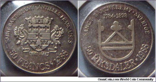 Saint Barthélemy | 
50 Francs/50 Riksdaler, 1988 | 
27.48 mm, 12.6 gr. | 
Nickel |  

Obverse: Supported arms, French text above, denomination below, date right |  
Lettering: SAINT BARTHÉLÉMY • ANTILLES FRANCAISES 50 FRANCS • 1988 | 

Reverse: Stylized arms, Swedish text above and years of the Swedish ownership, denomination below, date right | 
Lettering: SANCT BARTHÉLEMY • SVERIGE 1784-1878 50 RIKSDALER • 1988 |
