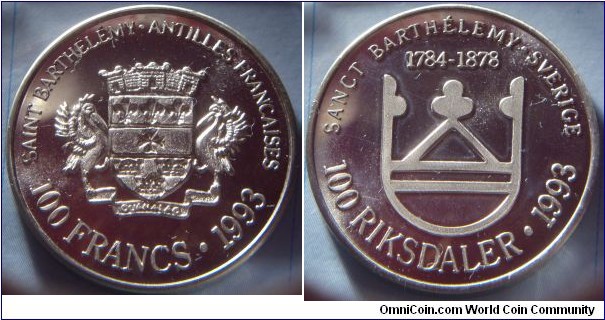 Saint Barthélemy | 
100 Francs/100 Riksdaler, 1993 | 
30.14 mm, 15.3 gr. | 
Nickel |  

Obverse: Supported arms, French text above, denomination below, date right |  
Lettering: SAINT BARTHÉLÉMY • ANTILLES FRANCAISES 100 FRANCS • 1993 | 

Reverse: Stylized arms, Swedish text above and years of the Swedish ownership, denomination below, date right | 
Lettering: SANCT BARTHÉLEMY • SVERIGE 1784-1878 100 RIKSDALER • 1993 |