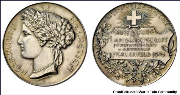 1903 Swiss Fraunefeld Agricultura Heldetica Medal by Durussel. Silver 50MM/52.93 gm.
Obv: Ceres goddess of agriculture to right. Legend HELUETICA AGRICULTURA. Rev: The Shield & Laural.
