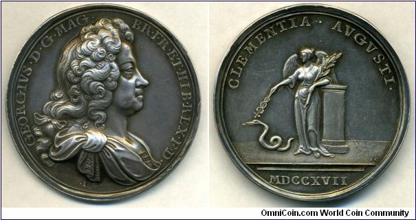 1717 UK George I, Passing of the Act of Grace and Free Pardon Medal by John Croker. Silver: 45MM./36gms.
Obv: Laurele Bust of George I in armour to right.t. Legend GEORGIVS.D.G.MAG.BR.FR.ET.HIB.REX.F.D. Sign .I.G. Rev: Shows Clemency with her attributes of peace and the serpent of rebellion. (The act was an amnesty offered to those who had engaged in recent rebellions by George I.) Legend CLEMENTIA.AVGVSTI. Exergue MDCCXVII.
