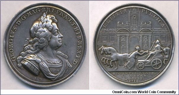 1714 UK George I, Entry into London Medal by John Croker. Silver: 47MM./44.6gms.
Obv: Laurele Bust of George I in armour to right.t. Legend GEORGIVS.D.G.MAG.BRI.FRA.ET.HIB.REX.F.D. Sihned I G. Rev:  The King proceeded from Greenwich in a state coach drawn by 8 horses and entered London accompanied no fewer than 250 carriages. Being given the keys to the City by London before the Royal Exchange. Legend LAETITIA PVBLICA (The public rejoicing). Exergue: ADVENTVS.REGIS.IN.VBBEM.20.SEPT: 1714.
