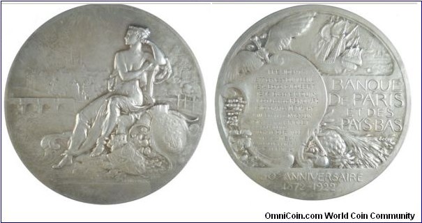 1922 France 1872-1922 50th Anniversary of the Banque de Paris Et Des Pays Bas Medal by Henry Nocq. Silver: 72MM./182.3 gms.
Obv: A seted female with cornucopia and two shield; a bridge and view of Paris in the background. Rev: A ship, caduces, cartouche under the sculptor. Legend: banque de paris et des pays-bas. Exergue: 50e ANNIVERSAIRE 1872-1922.
