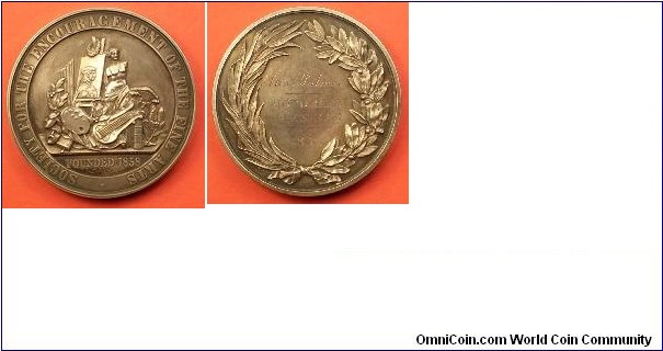 1858 UK The Society for The Encouragement of Fine Arts Medal by W.J. Taylor.. Silver: 51MM
Obv: Various objects symbolic of the arts. Rev: Inscription within a wreath: MISS PALMER HONORARY MEMBER 1868.
