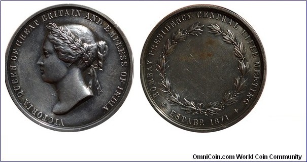 1871 UK India Bombay Presidency Central Rifle Meeting Medal. Silver 39MM.
Obv: Bust Queen Victoria right. Legend VICTORIA QUEEN OF GREAT BRITAIN AND EMPRESS OF INDIA. Rev: Legend around edge BOMBAY PRESIDENCY CENTRAL RIFLE MEETING. ESTABE 1871 , closed wreath with blank centre of award inscription. Left blank.
