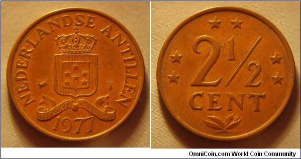Netherlands Antilles | 
2½ Cent, 1977 | 
22 mm, 4 gr. | 
Bronze | 

Obverse: National Coat of Arms, date below | 
Lettering: NEDERLANDSE ANTILLEN 1977 | 

Reverse: Six stars representing the six islands federation, denomination centre | 
Lettering: ** ** ** 2½ CENT |