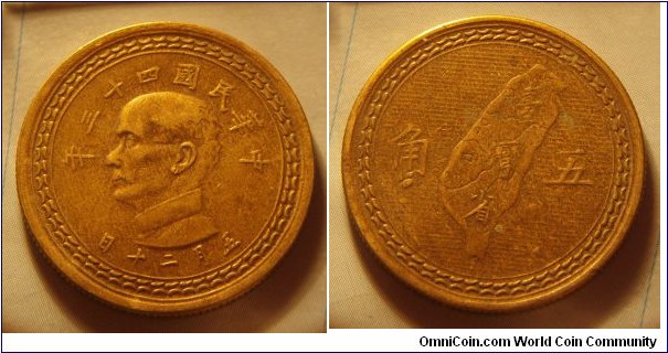 Taiwan | 
5 Jiao, 1954 (43) | 
27 mm, 7 gr. | 
Brass | 

Obverse: Sun Yat-Sen facing left, date above | 
Lettering: 年三十四國民華中 日十二月无 | 

Reverse: Map of Taiwan divides denomination | 
Lettering: 角 五 |