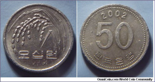 South Korea | 
50 Won, 2002 | 
21.16 mm, 4.16 gr. | 
Copper-zink-nickel | 

Obverse: Rice plant, denomination below | 
Lettering: 오십원 | 

Reverse: Denomination, date above | 
Lettering: 2002 50 한국은행 |
