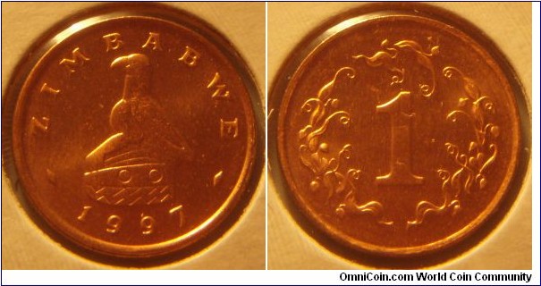 Zimbabwe | 
1 Cent, 1997 | 
18.45 mm, 3 gr. | 
Bronze plated Steel | 

Obverse: National Coat of Arms, date below | 
Lettering: ZIMBABWE 1997 | 

Reverse: Denomination | 
Lettering: 1 |