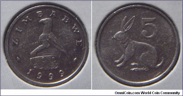 Zimbabwe | 
5 Cents, 1999 | 
17 mm, 2.5 gr. | 
Copper-nickel | 

Obverse: National Coat of Arms, date below | 
Lettering: ZIMBABWE 1999 | 

Reverse: Jamesons Red Rock Rabbit facing left, denomination above | 
Lettering: 5 |