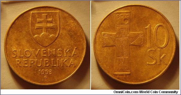 Slovakia | 
10 Korún, 1993 | 
26.5 mm, 6.6 gr. | 
Aluminium-bronze | 

Obverse: National Coat of Arms, date below | 
Lettering: SLOVENSKÁ REPUBLIKA 1993 | 

Reverse: Bronze cross (11th century AD), denomination right | 
Lettering: 10 Sk |