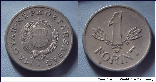 Hungarian People's Republic | 
1 Forint, 1967 | 
22.8 mm, 1.5 gr. | 
Aluminium | 

Obverse: National Coat of Arms, date below | 
Lettering: • MAGYAR • NÉPKÖZTÁRSASÁG 1967 | 

Reverse: Denomination | 
Lettering: 1 FORINT |