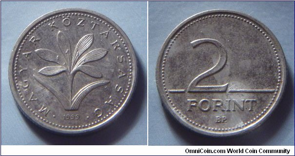 Hungary | 
2 Forint, 1999 | 
19 mm, 3.1 gr. | 
Copper-nickel | 

Obverse: The Hungarian crocus (Colchium Hungaricum), date below | 
Lettering: • MAGYAR KÖZTÁRSASÁG • 1999 | 

Reverse: Denomination | 
Lettering: 2 FORINT |