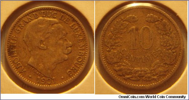 Luxembourg | 
10 Centimes, 1901 | 
20 mm, 2.95 gr. | 
Copper-nickel | 

Obverse: Adolphe, Grand Duke of Luxembourg facing right, date below | 
Lettering: • ADOLPHE GRAND DUC DE LUXEMBOURG • 1901 |

Reverse: Denomination within wreath | 
Lettering: 10 CENTIMES |