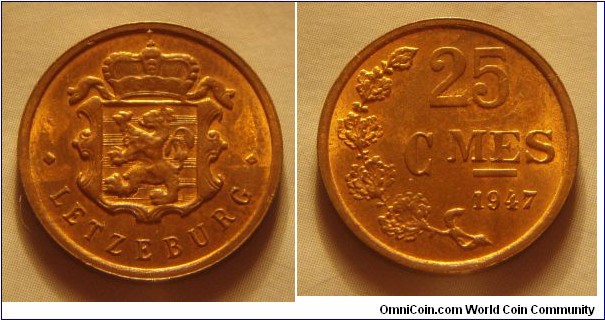 Luxembourg | 
25 Centimes, 1947 | 
19 mm, 2.5 gr. | 
Bronze | 

Obverse: National Coat of Arms | 
Lettering: • LETZEBURG • |

Reverse: Denomination, date below | 
Lettering: 25 CMES 1947 |
