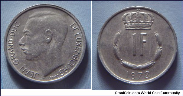 Luxembourg | 
1 Franc, 1972 | 
21 mm, 4 gr. | 
Copper-nickel | 

Obverse: Adolphe, Grand Duke of Luxembourg facing right | 
Lettering: JEAN GRAND-DUC DE LUXEMBOURG |

Reverse: Crowned  upturned horseshoe shaped of six flower buds surrounds denomination, date below | 
Lettering: 1F 1972 |