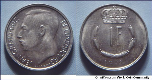 Luxembourg | 
1 Franc, 1981 | 
21 mm, 4 gr. | 
Copper-nickel | 

Obverse: Adolphe, Grand Duke of Luxembourg facing right | 
Lettering: JEAN GRAND-DUC DE LUXEMBOURG |

Reverse: Crowned  upturned horseshoe shaped of six flower buds surrounds denomination, date below | 
Lettering: 1F 1981 |