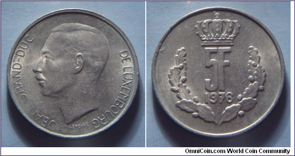 Luxembourg | 
5 Francs, 1976 | 
24 mm, 6 gr. | 
Copper-nickel | 

Obverse: Jean, Grand Duke of Luxembourg facing left | 
Lettering: JEAN GRANDE-DUC DE LUXEMBOURG |

Reverse: Crowned denmoniation within wreath, date below | 
Lettering: 5F 1976 |