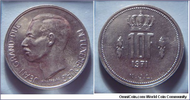 Luxembourg | 
10 Francs, 1971 | 
27 mm, 8 gr. | 
Nickel | 

Obverse: Jean, Grand Duke of Luxembourg facing left | 
Lettering: JEAN GRANDE-DUC DE LUXEMBOURG |

Reverse: Crown divides date, denmoniation below | 
Lettering: 10F 1971 |