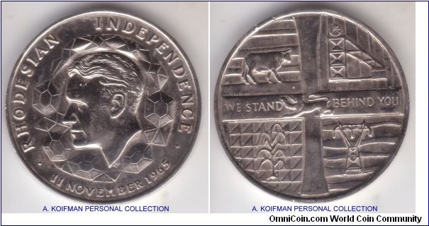 1965 Rhodesia independence medal; nickel, plain edge; common issue with the RHODESIAN INDEPENDENCE 11 NOVEMBER 1965 on obverse with Ian Smith and WE STAND BEHIND YOU on reverse; what is unusual is that there are no references to the nickel or copper-nickel medals, only silver and bronze; extra fine for wear and some nicks.