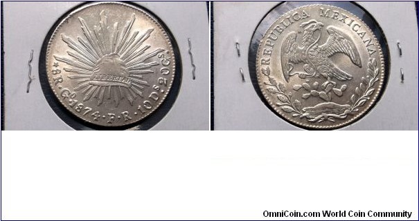 SCARCE SILVER 1874 GoFR MEXICO 8 REALES GEM BU FULL LUSTER

Specifications

Composition: Silver

Fineness: 0.9030

Weight: 27.0700g

ASW: 0.7859oz

Melt Value: $12.36 (7/3/2015)
Design

Obverse: Facing eagle, snake in beak

Obverse Legend: REPUBLICA MEXICANA

Reverse: Radiant cap
Notes

Note:  Varieties exist. 