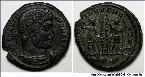 Constantine I AE follis. AD 330-335. Trier. CONSTANTI-NVS MAX AVG, rosette-diademed, draped, cuirassed bust right / GLOR-IA EXERC-ITVS, two soldiers holding spears and shields with two standards between them. Standards have no drapery and very thin shafts with pointed tops instead of banners. Mintmark: TR dot P.