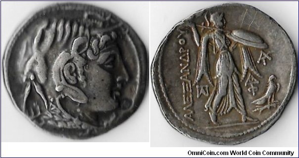 Ptolemy I tetradrachm as Satrap of Egypt. Obverse: bust of Alexander the Great with elephant headdress. Reverse: Athena Alkidemos walking to right with spear and shield with owl bottom right.  monograms in left and right fields.  This example also has a small `omega' countermark at Alexander's chin (obverse). Circa 310 /305 BC