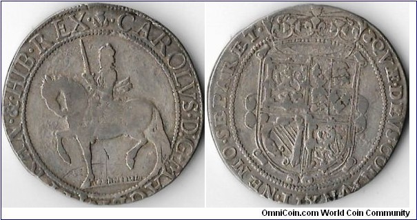 silver thirty shillings struck between 1625 /49 (Sir John Falconer's anonymous coinage). Although it looks like this example looks like gremlins had been stealing silver from the coin the shape is typical of this particular issue.