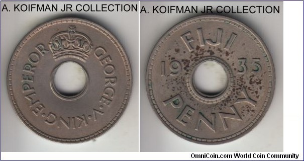 KM-2, 1935 Fiji penny; copper-nickel, holed flan, plain edge; George V, less common type, good extra fine details, reverse shows spotted toning.