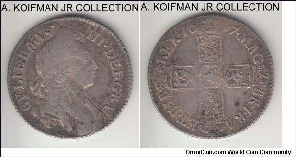KM-485.1, 1697 Great Britain shilling; silver, slant reeded edge; William III, appear top be the first laureate bust, good fine, likley ex-jewelry (over the date) but no edge damage and overall well struck.