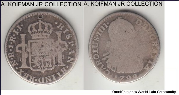 KM-58, 1799 Colombia real; silver; Charles IV, N.R. mint mark, JJ assayer initials, scarce type and uncommon year, very good, cross drilled out on reverse, either attempted piercing or some anti-clerical message.