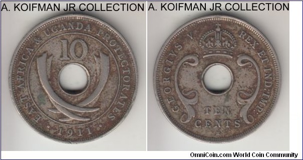 KM-8, 1911 British East Africa & Uganda 10 cents, Heaton mint (H mint mark); copper-nickel, holed flan, plain edge; George V, 4-year type, very fine details, environmental impact, cleaned.
