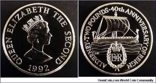 Alderney 2 pounds.
1992, 0th Anniversary of Queen's Reign. Cu-ni. Weight; 28,28g. Diameter; 38,5mm.