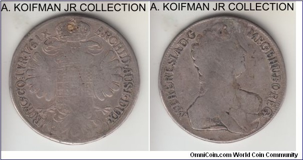KM-1817, 1761 Austria thaler, Vienna mint; silver, lettered edge; Maria Theresia, fine or almost, ex-jewelry and plugged.