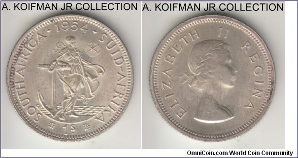 KM-49, 1954 South Africa (Dominion) shilling; silver, reeded edge; Elizabeth II, common year, borderline uncirculated, obverse may have been lightly cleaned.