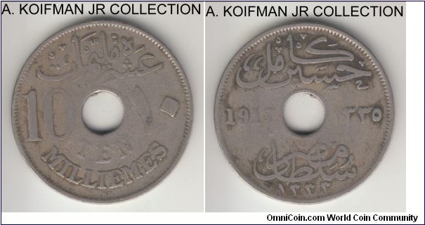 KM-316, AH1335 (1917) Egypt 10 milliemes, Kings Norton mint (KN mint mark); copper-nickel, holed flan, plain edge; Sultan Hussein Kamil under British occupation, well circulated very good or about.