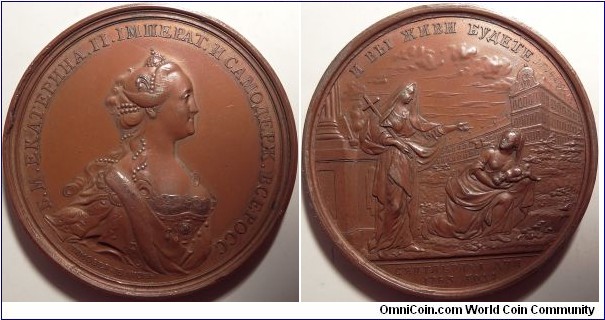 AE Medal on the Establishment of the Founding Home in St. Petersburg on the 1st of September 1763. Dies by T. Ivanov. Crowned and mantled bust to right. Rv. Faith holding a cross on her shoulder consoling a woman with infant in her hands. Diakov 123.2