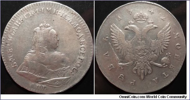 AR 1 Rouble 1742 SBP  (with SPB edge) struck over 1741 Rouble of Ioan VI.  https://www.m-dv.ru/catalog/p,411485/image.html