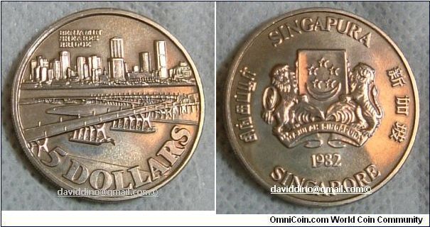 SINGAPORE 1982 $5 CUPROUS NICKEL PROOF-LIKE, FEATURING BENJAMIN SHERES BRIDGE. DUE TO ITS CONTENT, IT HAS A DARK TINGE TO IT. FOR SALE. PLEASE MAKE AN OFFER..